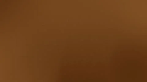 Seamless loop background in 4K with smooth brown gradient and subtle grid lines. Stock Footage 299397264