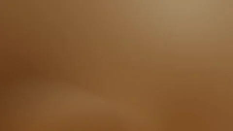 Seamless loop background in 4K with smooth brown gradient and soft halo shape Stock Footage 299448062