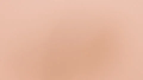 Seamless loop background in 4K. Soft beige gradient with subtle shading creates Stock Footage 299664583