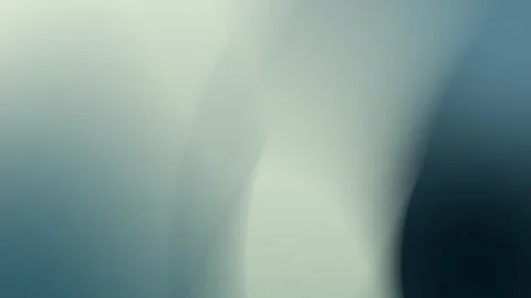 Seamless loop background in 4K with soft, fluid gradient of gray and dark blue Stockbeeldmateriaal 309701051