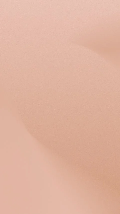 Seamless loop background in 4K of a soft peach gradient with warm, smooth curves Stockbeeldmateriaal 309855928