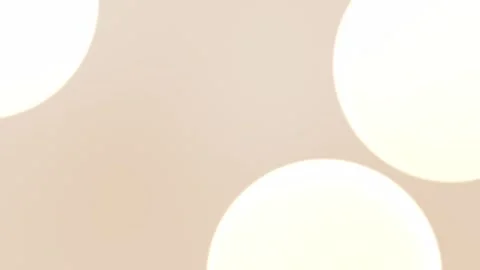Seamless loop background in 4K with soft beige hues and circular bokeh shapes, 動画素材 309956303