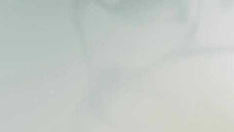 Seamless loop background in 4K with soft, blurred pastel gray and ivory hues Vídeo Stock 309956866