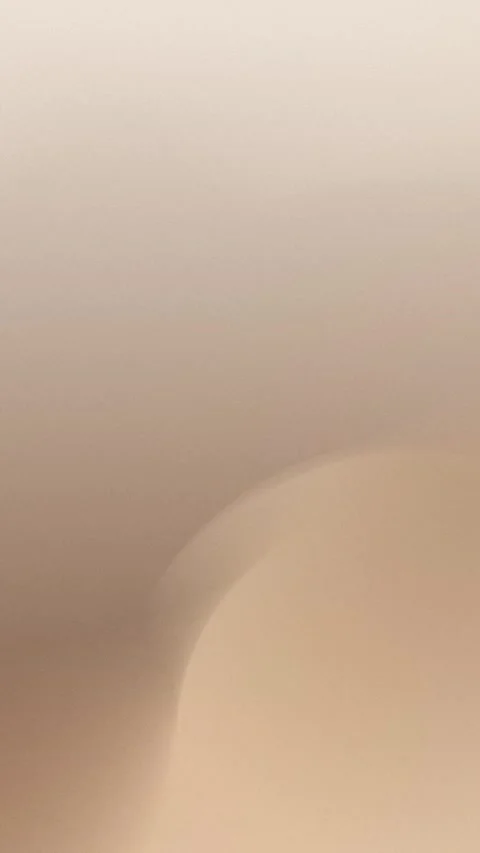 Seamless loop background in 4K with soft beige gradient, featuring smooth curves Stock Footage 309957016