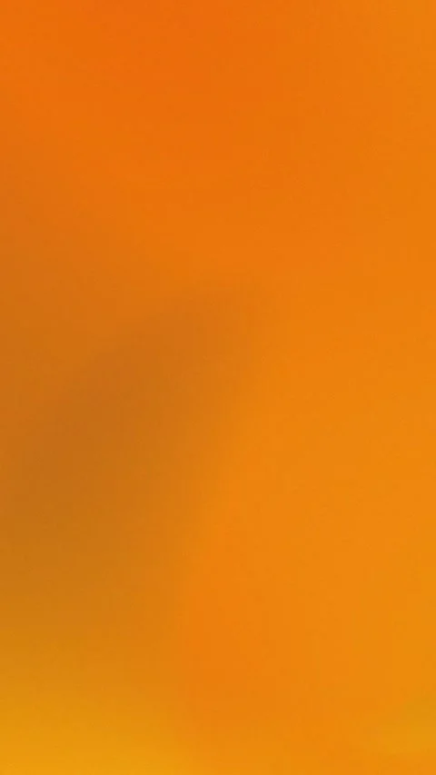 Seamless loop background in 4K with vibrant orange gradients and soft abstract Stock Footage 309956910