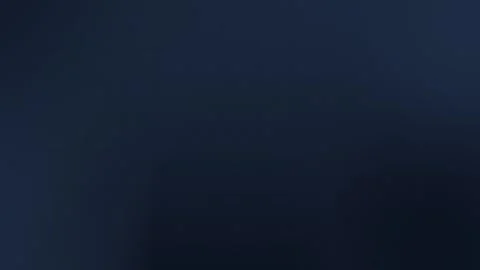 Seamless loop background in dark blue with subtle grid pattern. 4K texture. Stock Footage 309058595