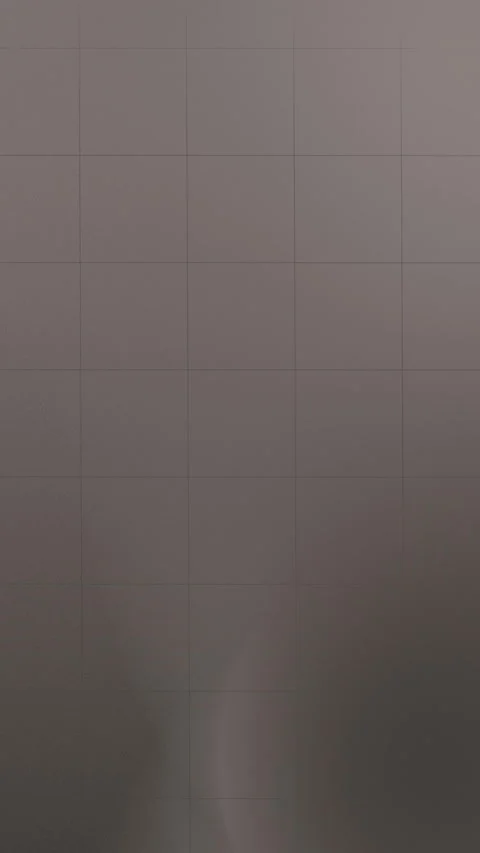 Seamless loop background featuring a grid with soft gray tones and subtle Stock Footage 309856113