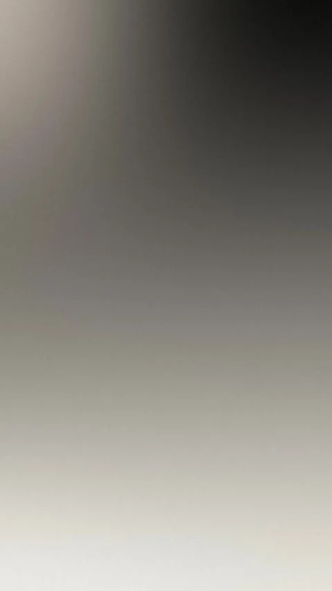 Seamless loop background featuring a smooth gradient with muted gray to black Stock Footage 309957041