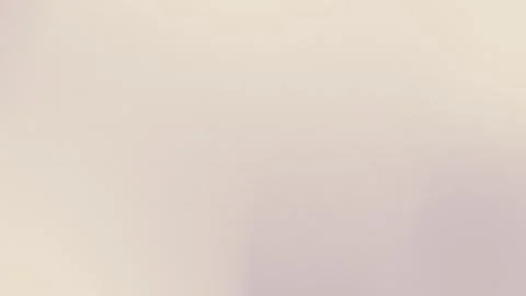 Seamless loop background featuring a soft beige gradient with fine grain texture Stock Footage 309058965