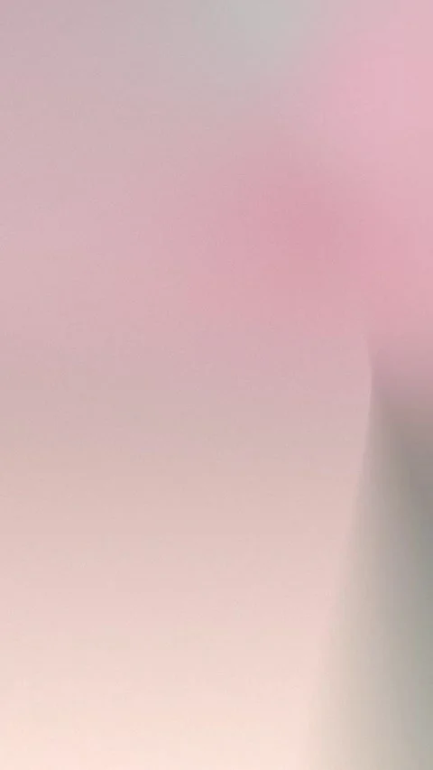 Seamless loop background featuring a soft, dreamy gradient of pinks and grays, Vidéo 309855870