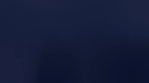 Seamless loop background featuring a subtle dark blue gradient with textured Stock Footage 309700530