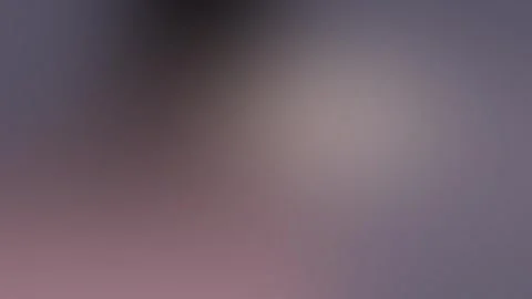 Seamless loop background featuring a vibrant, grainy gradient. Blends of purple, 動画素材 309855501