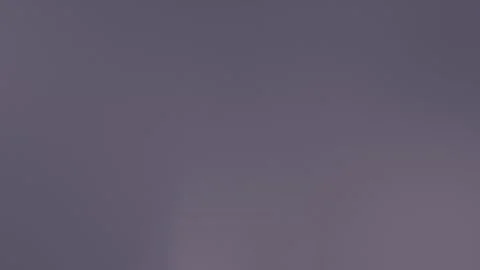 Seamless loop background featuring a vibrant red and orange gradient, divided by Stockbeeldmateriaal 309855601