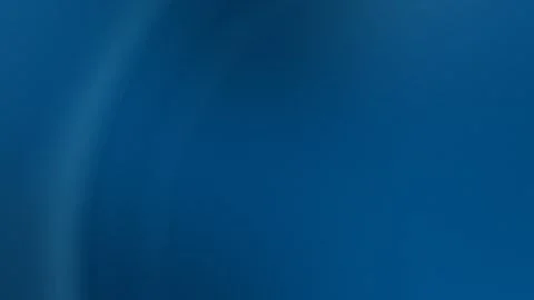 Seamless loop background with gradient blue hues and soft curves. 4K abstract Stock Footage 299397571