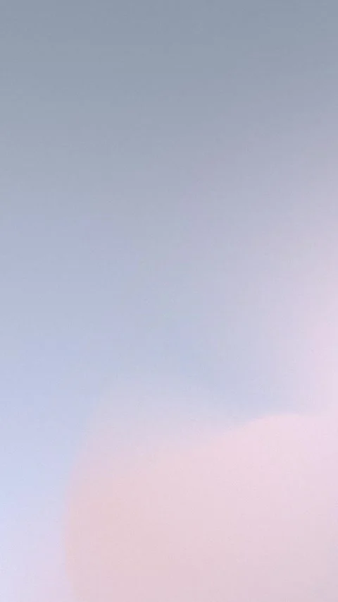 Seamless loop background with gradient hues of blue, green, and yellow fading. 動画素材 310143606