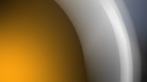 Seamless loop background with a gradient of orange and grey in a 4K abstract Stock Footage 300840248