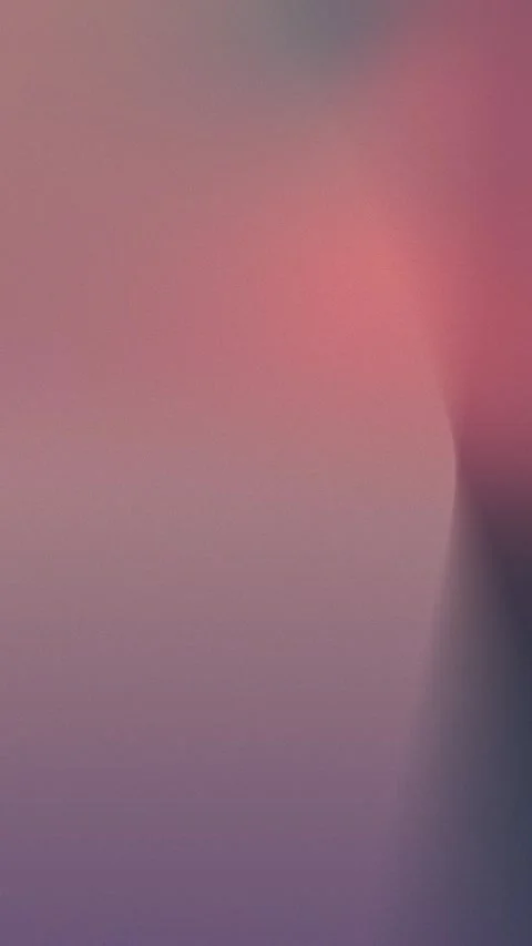Seamless loop background with a gradient of pink and purple tones, subtle grain Stock Footage 309956388