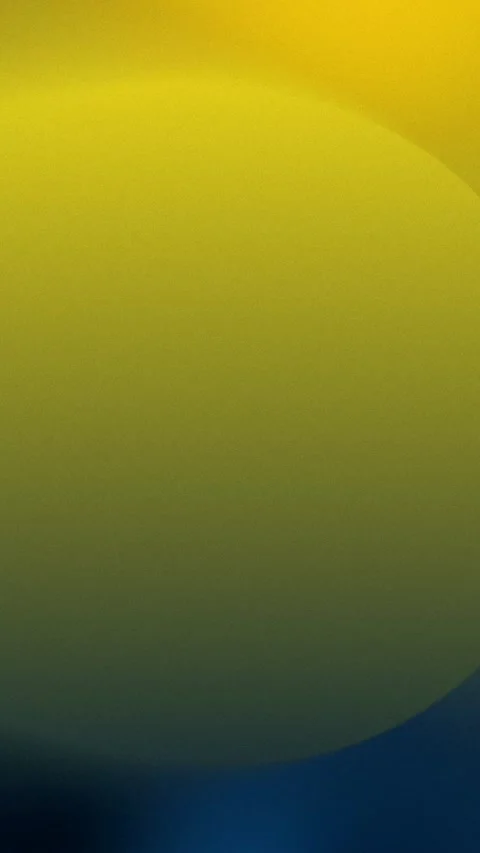 Seamless loop background with a gradient of yellow transitioning to blue. 4K. Stock Footage 309701552