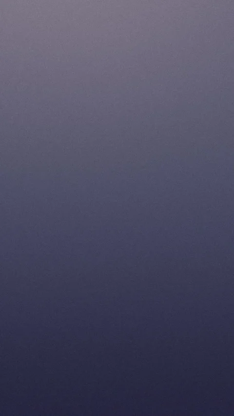 Seamless loop background of grainy gradient with purple hues. 4K. 動画素材 309701329