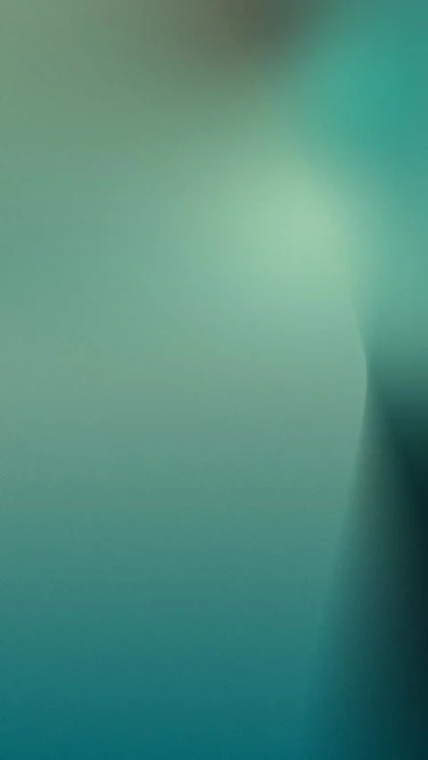 Seamless loop background with grainy green, yellow, and blue gradient. 4K Stock Footage 309701205