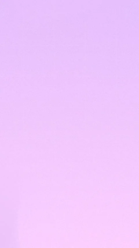 Seamless loop background with grainy soft pastel purple gradient. 4K. Stock Footage 309956899