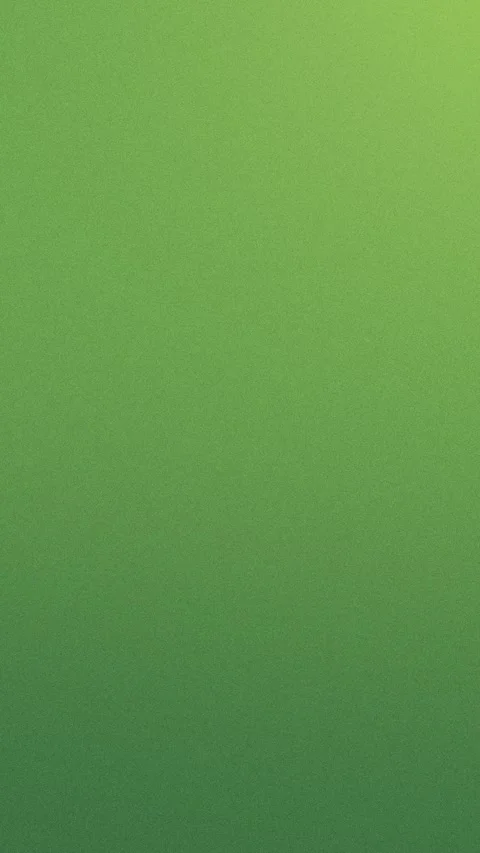 Seamless loop background with green gradient and fine grainy texture. 4K 動画素材 309855991