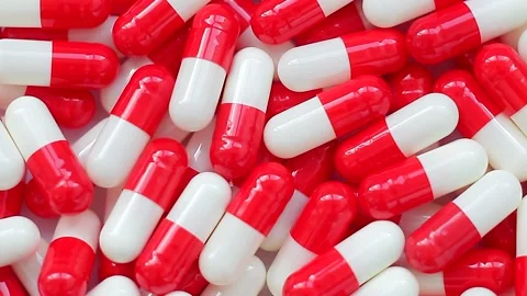 Seamless loop, background, intro. Rotation of white and red capsules Stock Footage 159618704