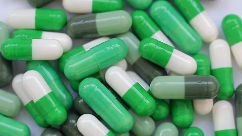 Seamless loop, background, intro. Rotation of white and green capsules Stock Footage 160829806