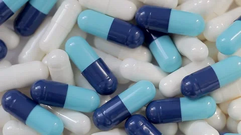 Seamless loop, background, intro. Rotation of white and blue capsules Stock Footage 160830428