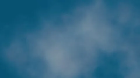 Seamless loop background with realistic flying through sparse white clouds Stock Footage 324711382