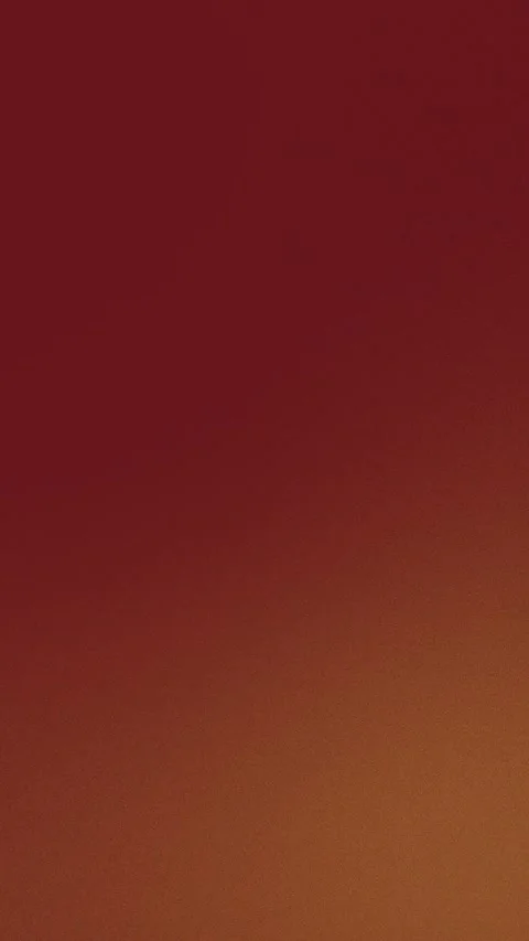Seamless loop background in rich burgundy and burnt orange gradient, 4K. Stock Footage 309956469