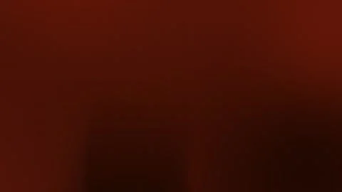 Seamless loop background in rich red hues with subtle textures in 4K. Smooth Stock Footage 309700547