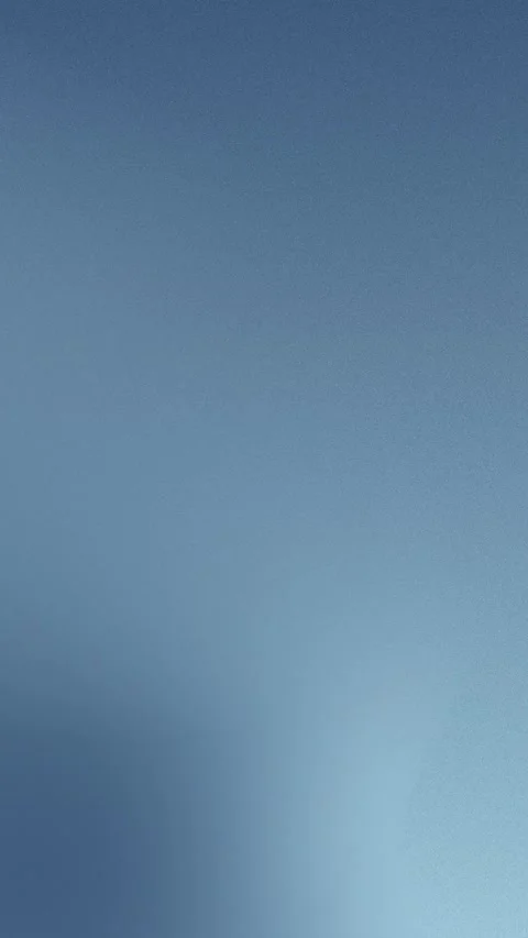 Seamless loop background with smooth blue gradient and subtle grain. 4K. Stock Footage 309957121