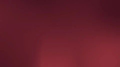 Seamless loop background with a smooth, deep red gradient. Soft transitions Stockbeeldmateriaal 309955686