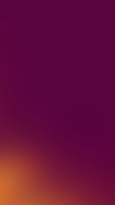 Seamless loop background with a smooth gradient from rich burgundy to warm Stock Footage 309855864