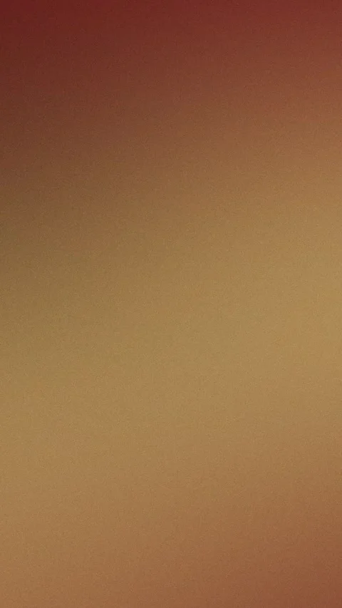 Seamless loop background with smooth red to beige gradient and fine grain. 4K. Stock Footage 309855990