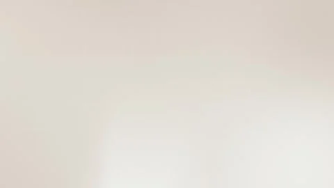 Seamless loop background in soft beige tones with subtle grid pattern, perfect Stock Footage 299397074