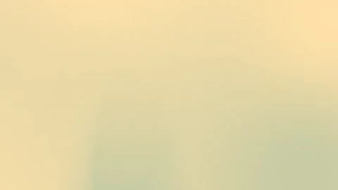 Seamless loop background in soft beige and pale green gradient with subtle Stock Footage 299397229