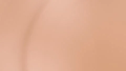 Seamless loop background with soft beige gradient, smooth curves. 4K abstract Stock Footage 299397474