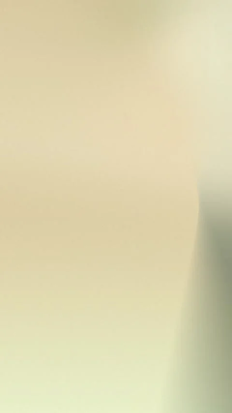 Seamless loop background with soft beige and olive gradients merging smoothly. Stock Footage 305344821