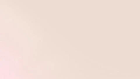 Seamless loop background in soft beige with subtle grainy texture. 4K quality. 库存影片 309058702