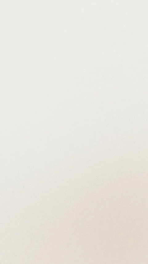 Seamless loop background with soft beige gradient. Subtle textured pattern. 4K. 動画素材 309956439