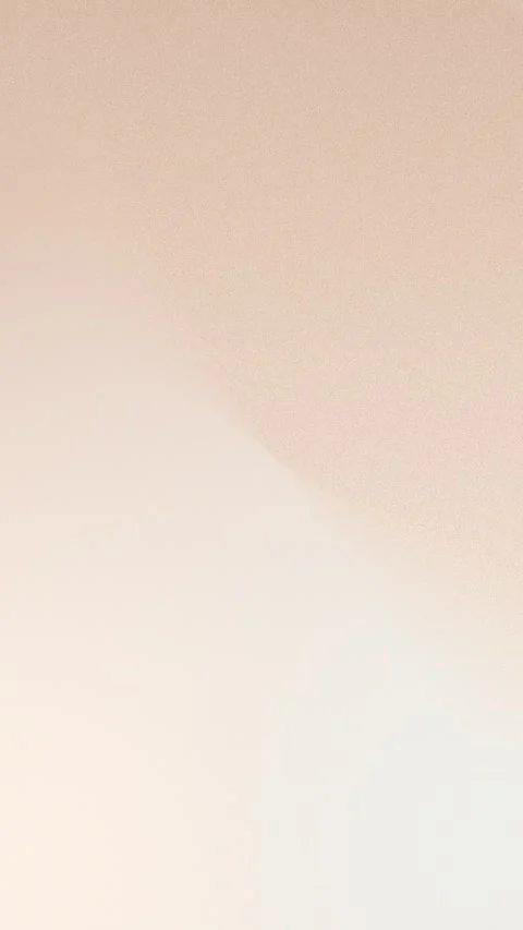 Seamless loop background of soft beige gradient with smooth transitions. 4K Stock Footage 309956485