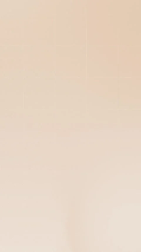 Seamless loop background with soft beige gradient in 4K, featuring subtle curves Stockbeeldmateriaal 309956893