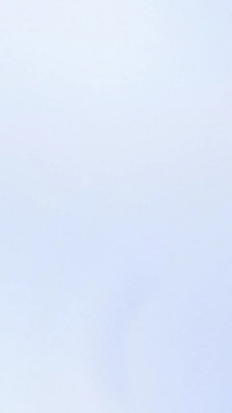 Seamless loop background with a soft blue and white gradient. 4K. 動画素材 309956908