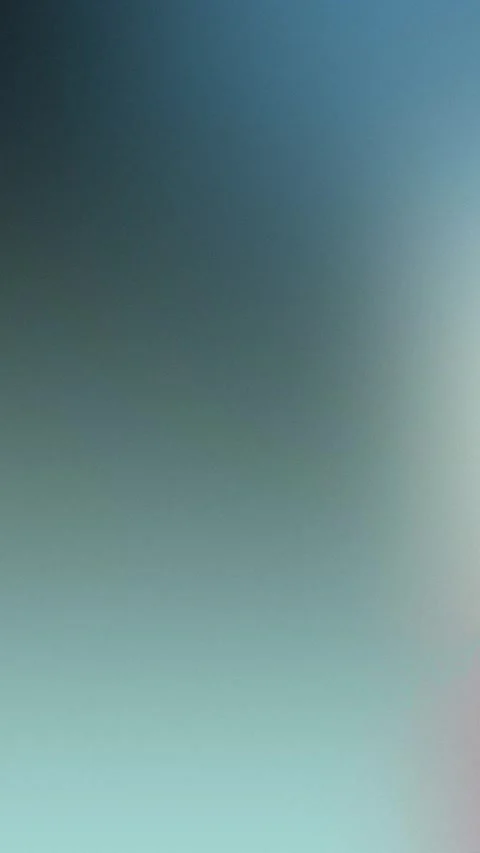 Seamless loop background with soft blue-green gradient blending into pink, 4K Stock Footage 310143584