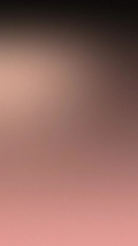 Seamless loop background with soft brown gradient transitioning to pink. 4K. Stock Footage 309957056