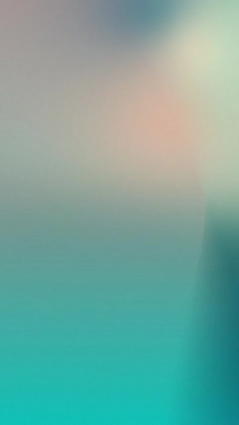 Seamless loop background with soft gradient hues of beige, red, and teal. 4K. Stock Footage 309701196