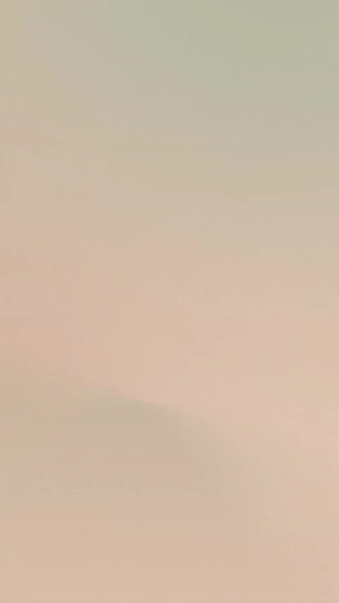 Seamless loop background with soft gradient of beige and cream curves, 4K. Stock Footage 309956957