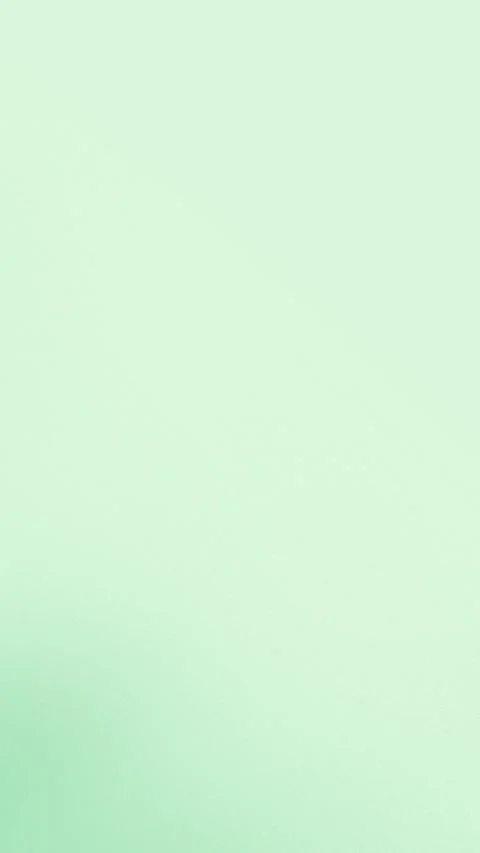 Seamless loop background in soft mint green gradient tones. 4K resolution. Видео 309855872